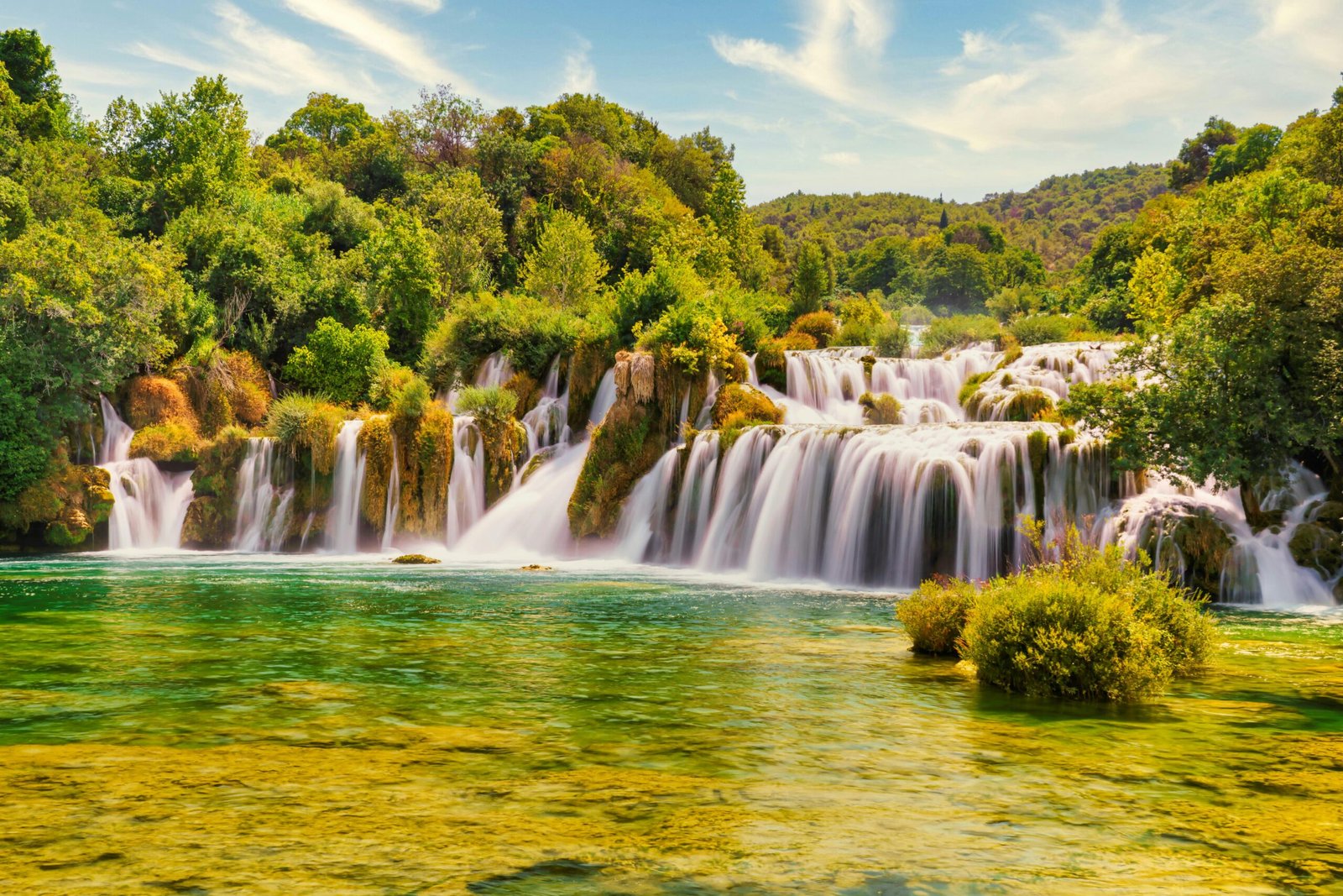 Explore the stunning cascades and lush greenery of Krka National Park's waterfalls in Croatia.